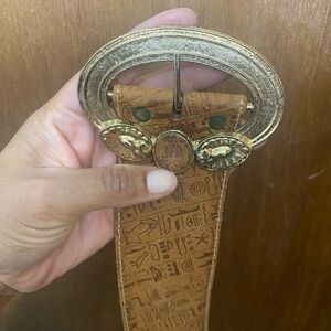Ornate Gold Buckle with Embossed Tan Belt